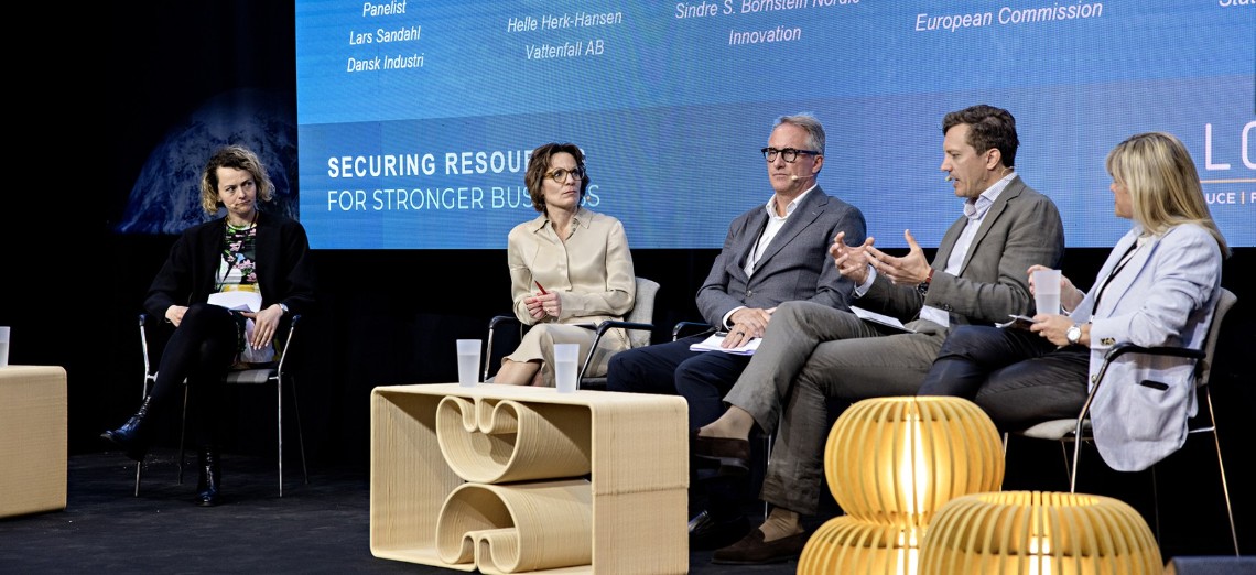 Four people in panel debate at Loop forum